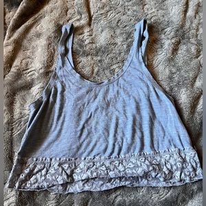 dark grey (almost black) and light blue cropped tank tops.